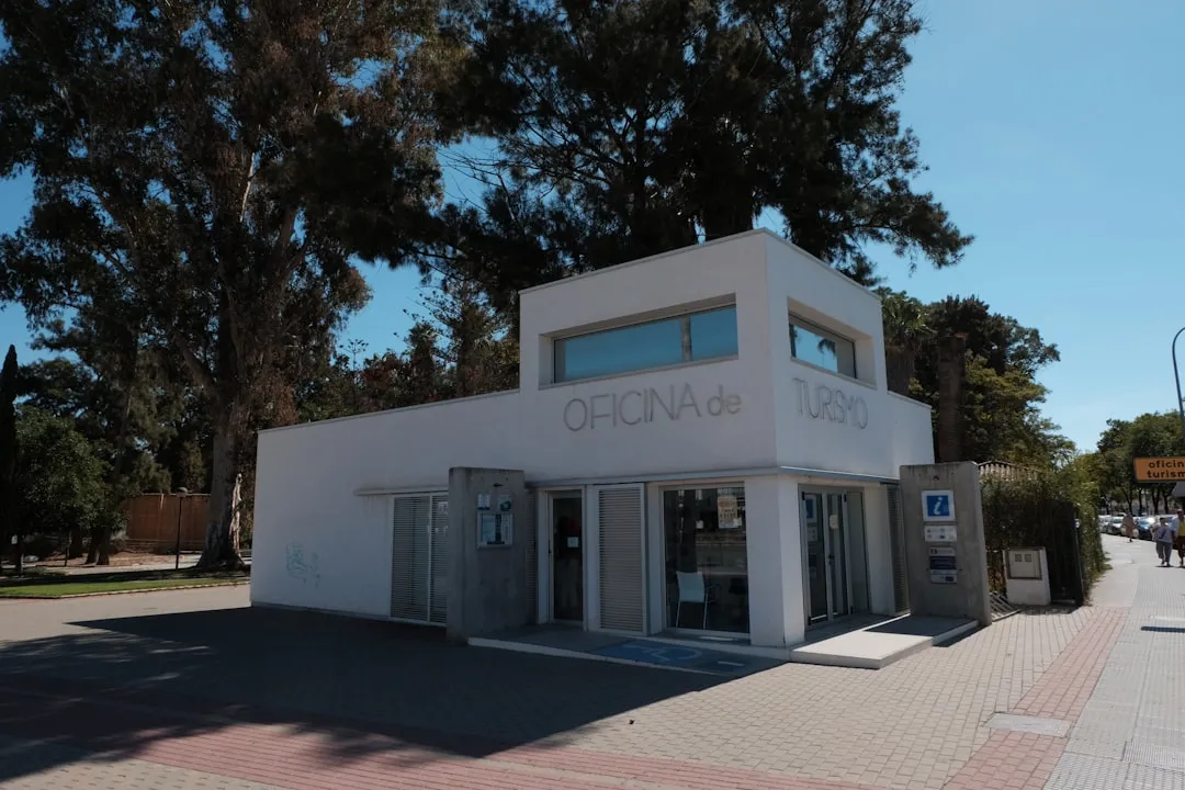 Modern white office building with trees and trees