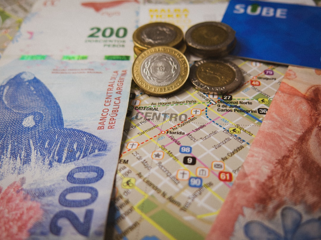 a bunch of money sitting on top of a map